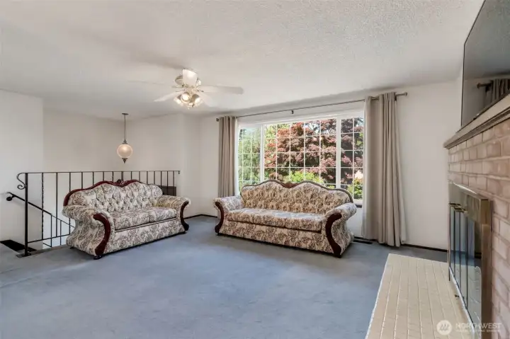 Spacious living room with lots of ambient light.