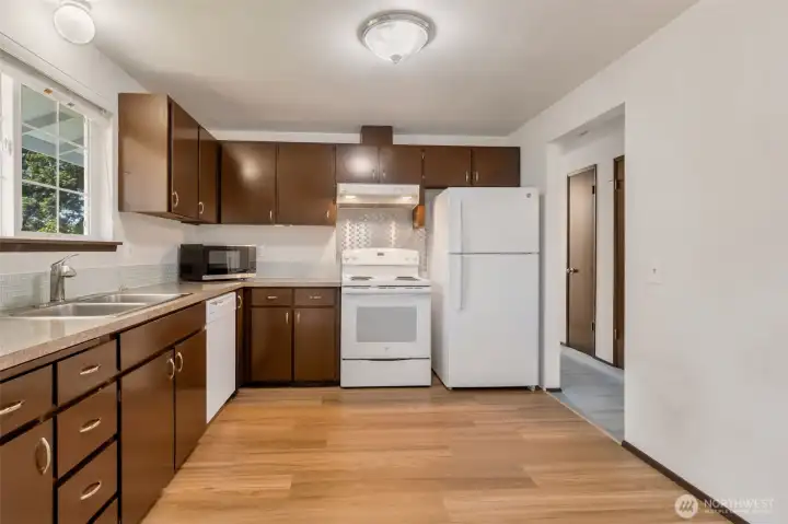 Bright sunny kitchen all appliances stay.