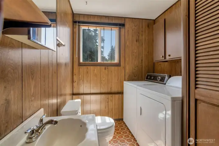 Utility room and half bath downstairs.