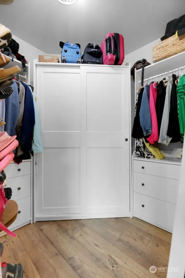Primary Walk In Closet with organizers