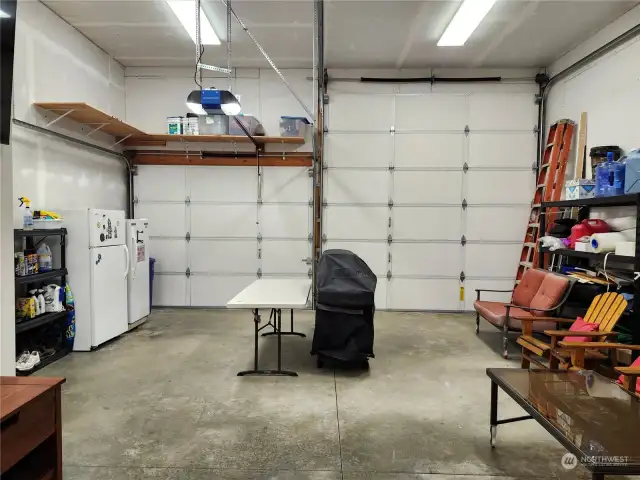 Inside garage showing 2 large roll up doors