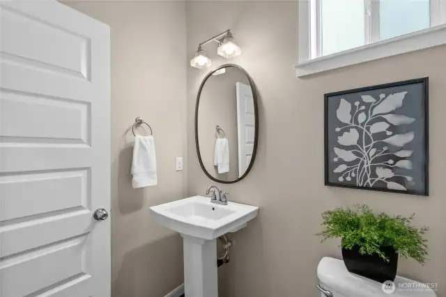 A powder room on the main is conveniently located between the dining room and the kitchen.