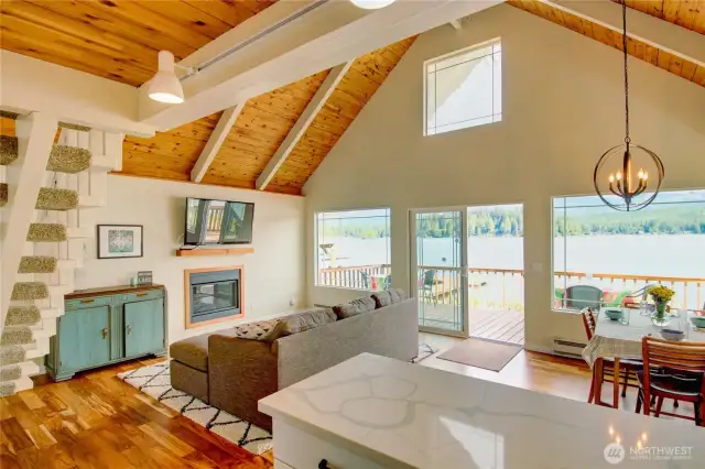 Living and dining open to lakeside deck.