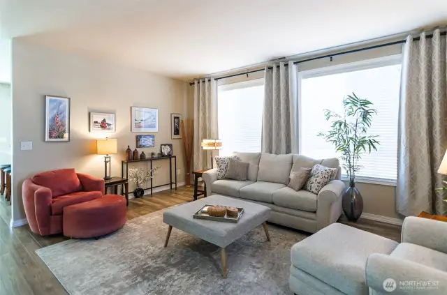 Main living area is centrally located and has large windows that allows for the flow of natural light.