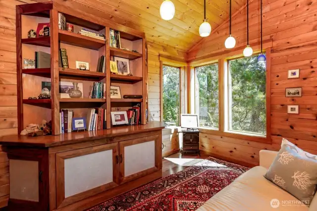 Primary bedroom with custom built bookcase. Viewing the the custom woodwork is a must.