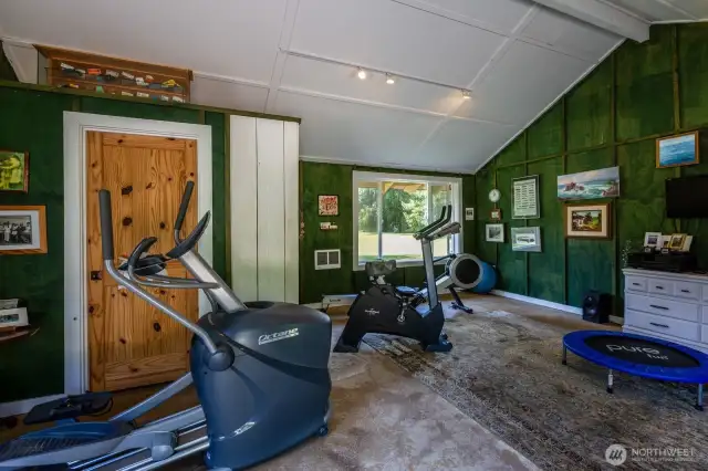 Remodeled detached building offers a room currently used as an exercise studio.
