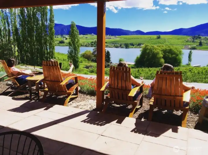 Enjoying wine and the view of Roses Lake