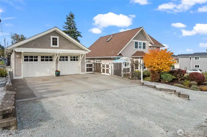 Side view of house showing detached 2-car garage/shop