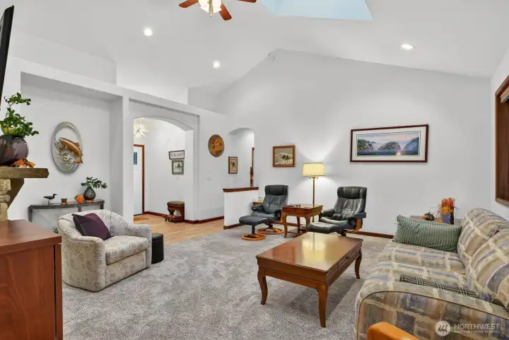 The stunning vaulted ceilings are a key feature, creating an expansive and light-filled atmosphere that makes this home truly special and inviting for comfortable living.