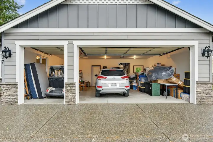 This garage is designed to accommodate two standard automobiles, and in addition to that, it also provides dedicated space for storing your golf cart.