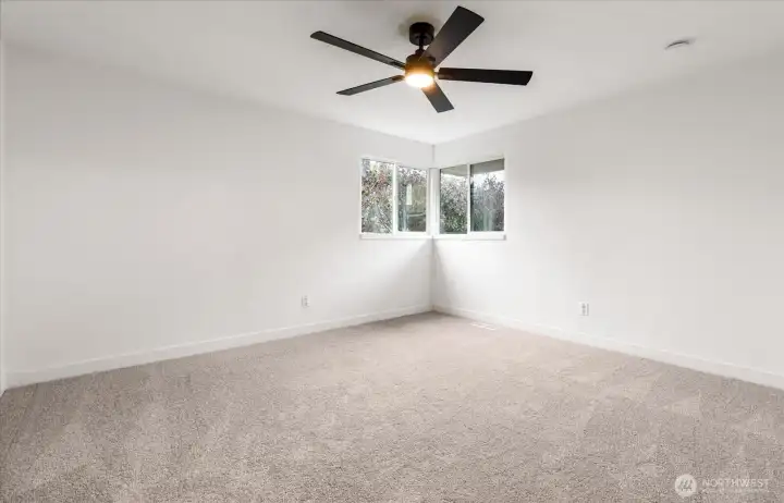 Bedroom 1 with brand new luxurious carpet and fan