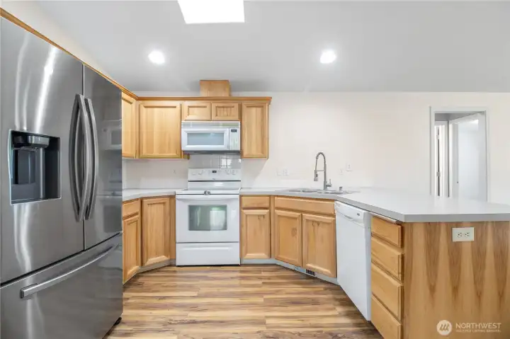 Kitchen view, all appliances included and plenty of counter space, I also love this flooring!