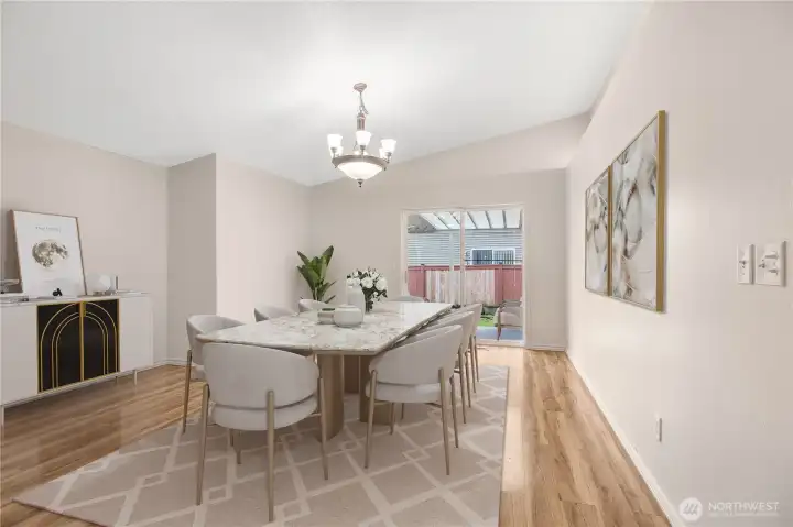 View of your dining area off the kitchen in the rear of the home, patio doors lead to your covered patio. ***Virtually Staged***