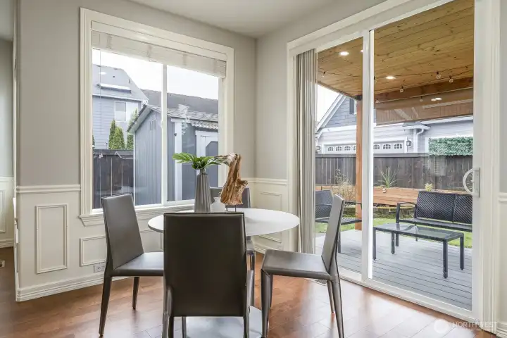 Breakfast nook and view of covered patio and yard