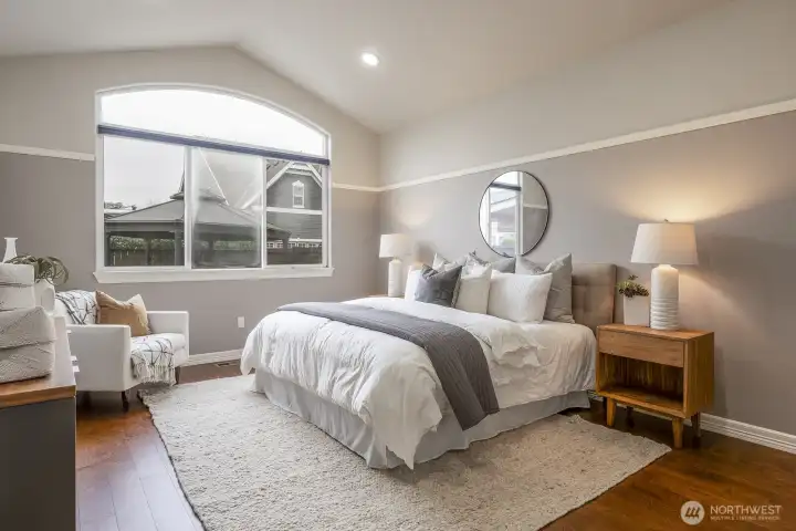 Primary bedroom on main floor with vaulted ceilings
