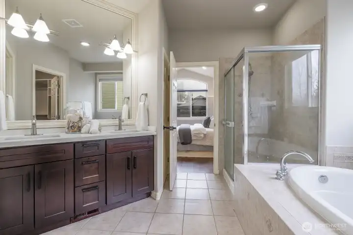 Primary suite 5-piece bathroom with soak tub and shower