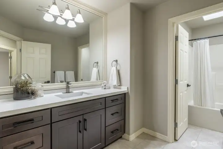 Full bathroom with double vanity upstairs