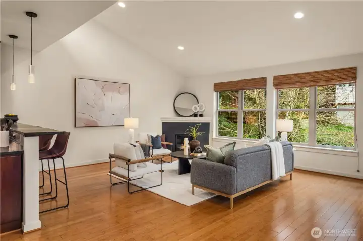 The living room features a vaulted ceiling with a clerestory window up above on the left.
