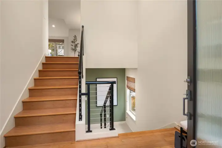The cable railing provides a nice contrast to the wood flooring.