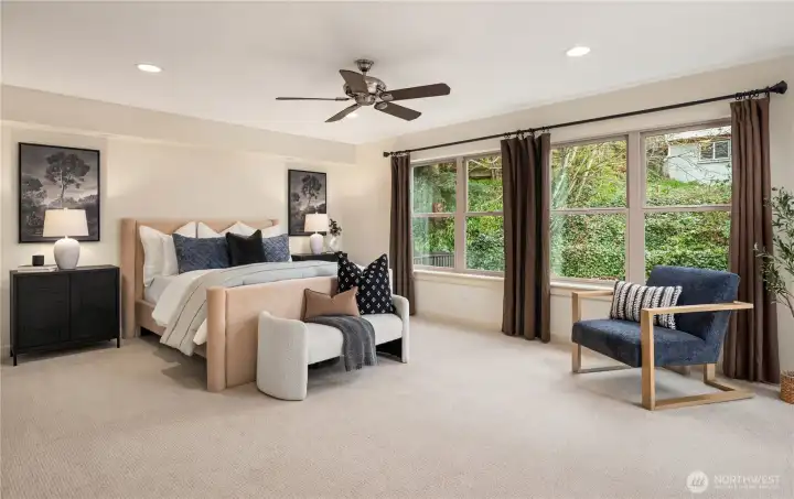 This more than king sized primary suite has room to spare as well as a private deck and enormous en-suite.