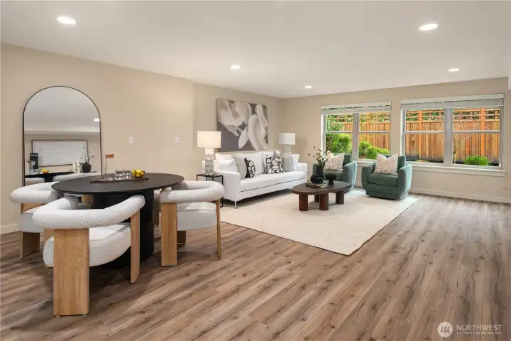 The massive rec room features a covered deck and lots of space. This level is also wired and plumbed for a second kitchen to the left.