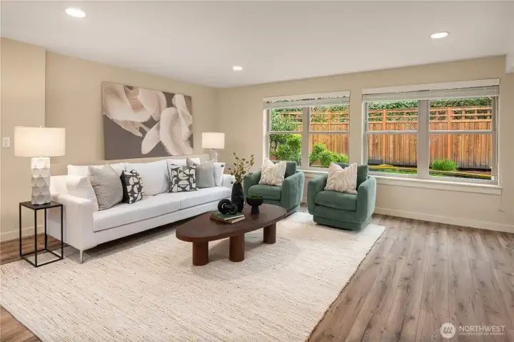 This pool sized rec room does not have a "basement-y" feel at all with plenty of windows and access to the backyard.