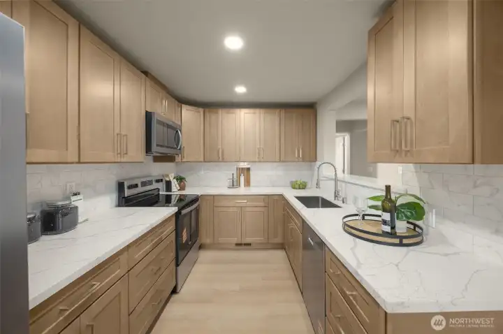 Updated kitchen. Ample cabinetry and SS appliances.