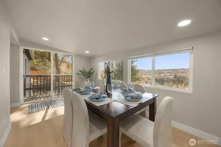 Dining area with sliding door to your deck. Big windows bring in ample lighting.