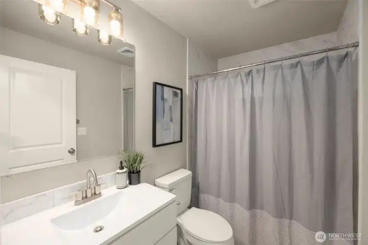 Full bathroom on main level (hallway).