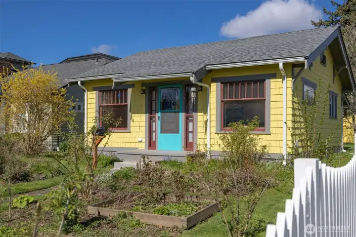 The freshly painted home has so much curb appeal and has a very welcoming front entry.
