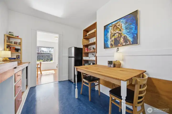 The new Marmoleum flooring is beautiful in the kitchen. There is also electrical for a range where the pantry shelves are, or to the left of the sink.