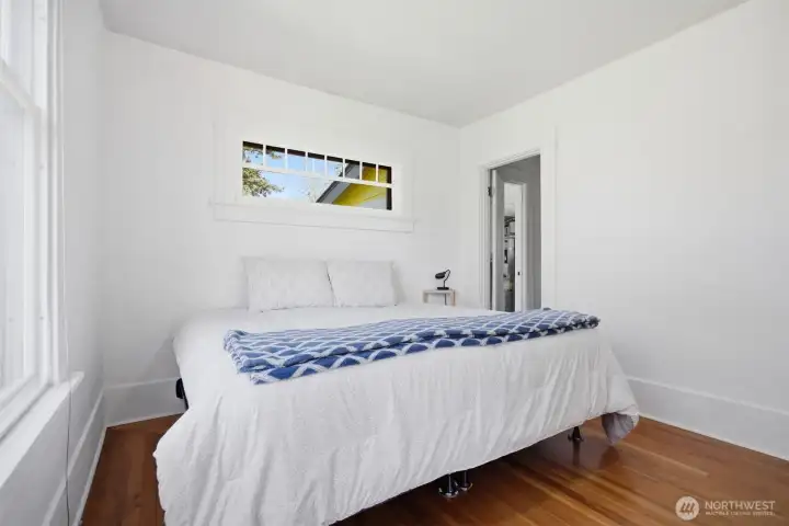 Looking across the bedroom toward the full bath.