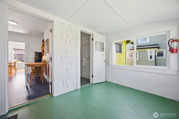 Another view of the utility room with access to the kitchen and full bath.