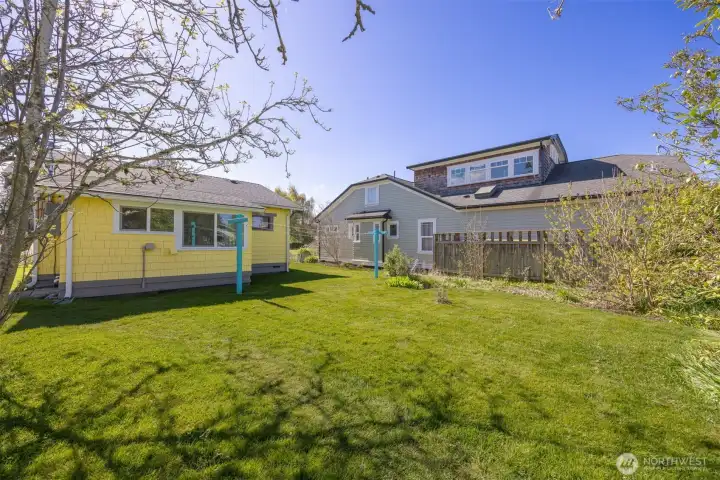 The rear yard is level and spacious and there is a clothes line.