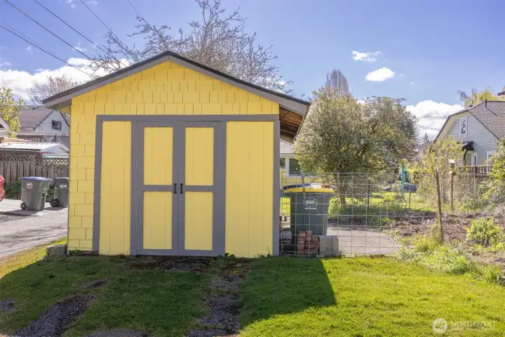 The garage housed the past owner's motorcycle and bicycles, and he would park his vehicle adjacent to it on the slab that is now fenced for a garden area.
