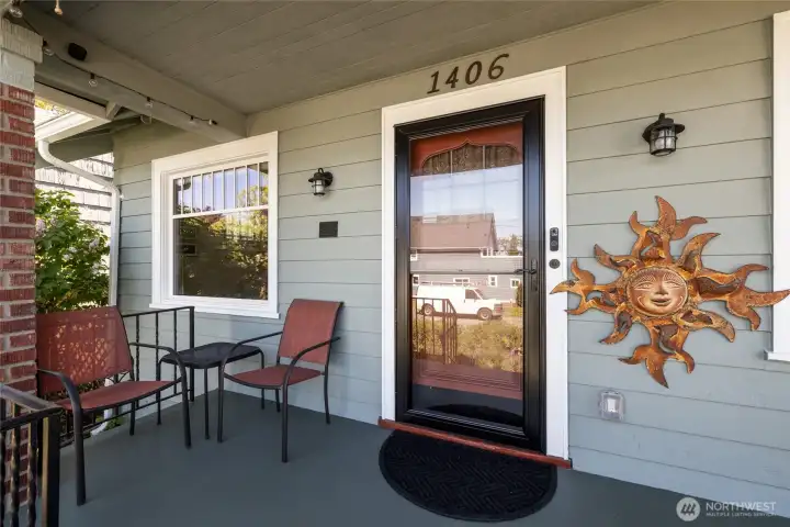 Covered front porch to enjoy the neighborhood, rain or shine!