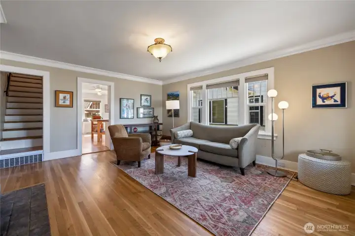 Refinished hardwood floors in the airy living room.
