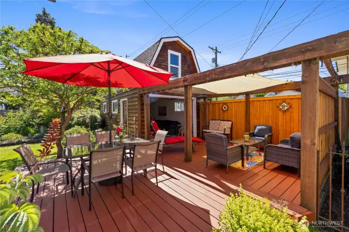 The detached studio with garage door makes for ideal indoor/outdoor living.