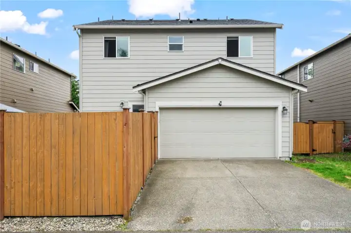 Garage with additional parking. EV charger staying with the home Garage with additional parking. EV charger staying with the home