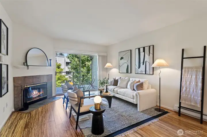 Beautiful living room anchored by wood burning fireplace with slate tile surround and mantle. Beautiful living room anchored by wood burning fireplace with slate tile surround and mantle.