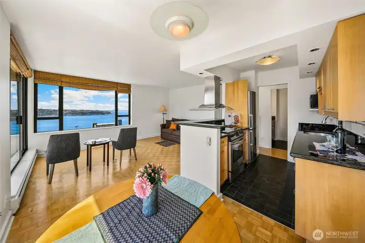 The open concept allows for lively conversation with guests, while preparing delicious meals.