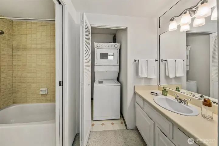 Primary bathroom with laundry.