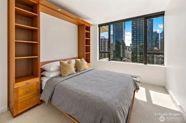 Wall bed in the bedroom allows for flexability of the space.