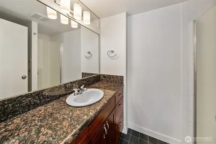 3/4 bathroom located across from the kitchen.