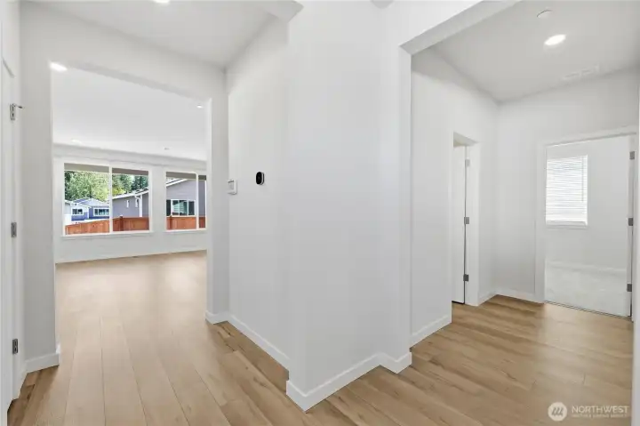 To the right is a 3/4 bathroom and one bedroom. Straight ahead leads into the living area and kitchen. To the right is a 3/4 bathroom and one bedroom. Straight ahead leads into the living area and kitchen.
