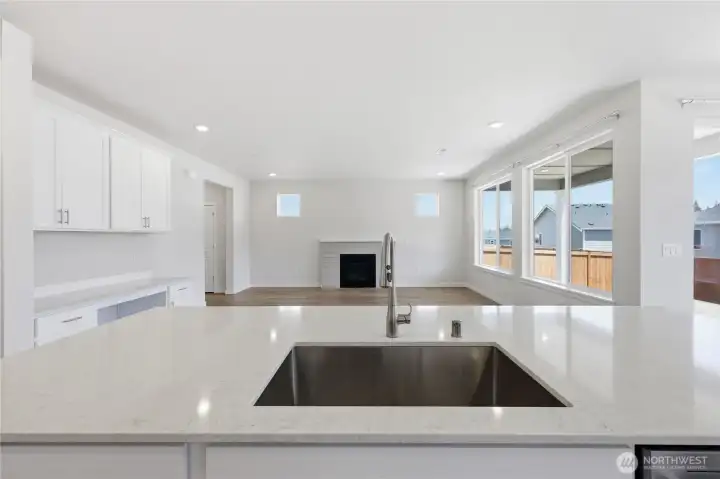 Be at the control center in this kitchen with large quartz counter top. Be at the control center in this kitchen with large quartz counter top.
