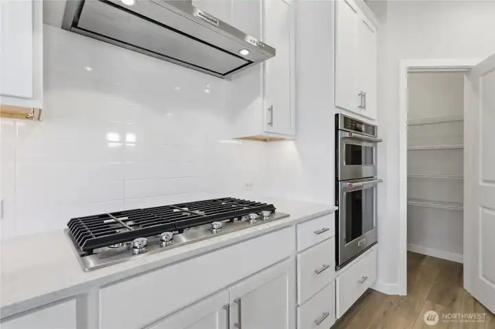 The white subway tiles highlight the cooking area. The white subway tiles highlight the cooking area.
