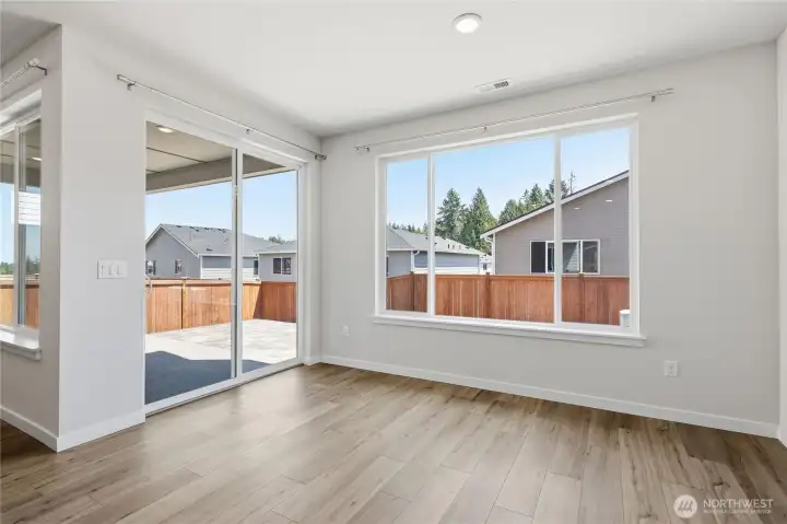 The dining room leads out onto the deck and patio. The dining room leads out onto the deck and patio.