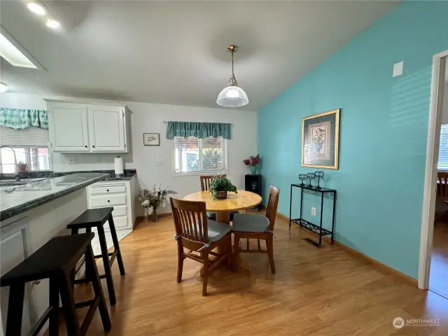 Dining area, which also leads to the kitchen with eating bar.