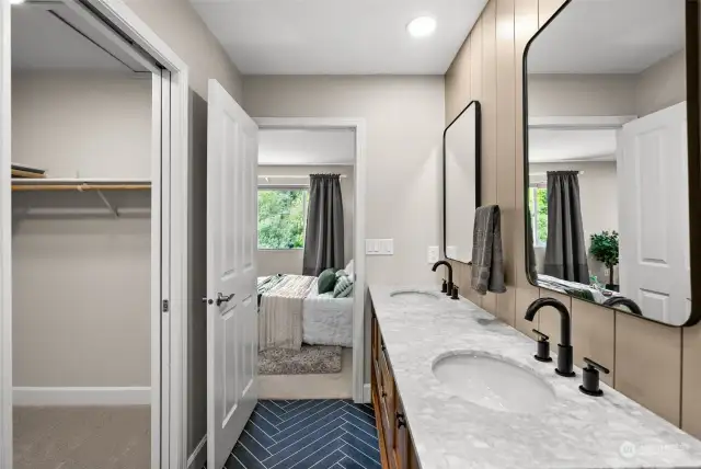 En suite primary bath with lake views from your shower and a walk in closet.